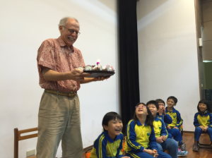 Dr. Jackson celebrating his 72nd birthday with school children